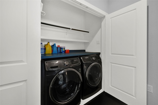 clothes washing area with washer and dryer