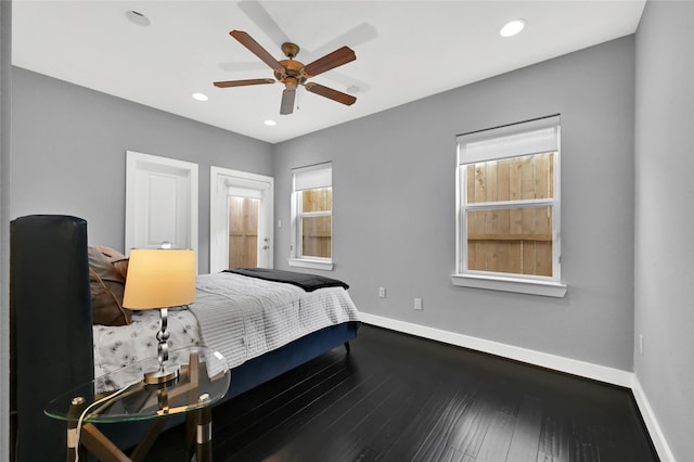 bedroom with hardwood / wood-style floors and ceiling fan