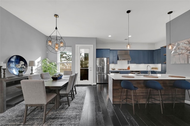 dining space with dark hardwood / wood-style flooring and sink