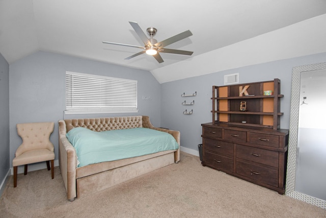 bedroom featuring lofted ceiling, light carpet, and ceiling fan