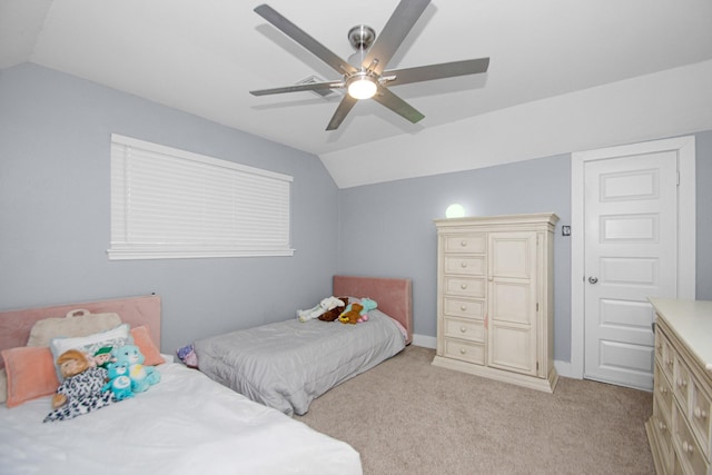 carpeted bedroom with lofted ceiling and ceiling fan