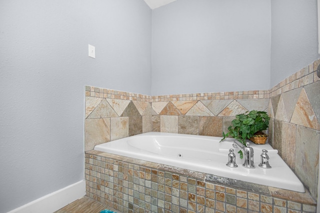 bathroom featuring a relaxing tiled tub