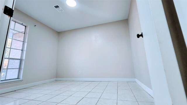 spare room with light tile patterned floors