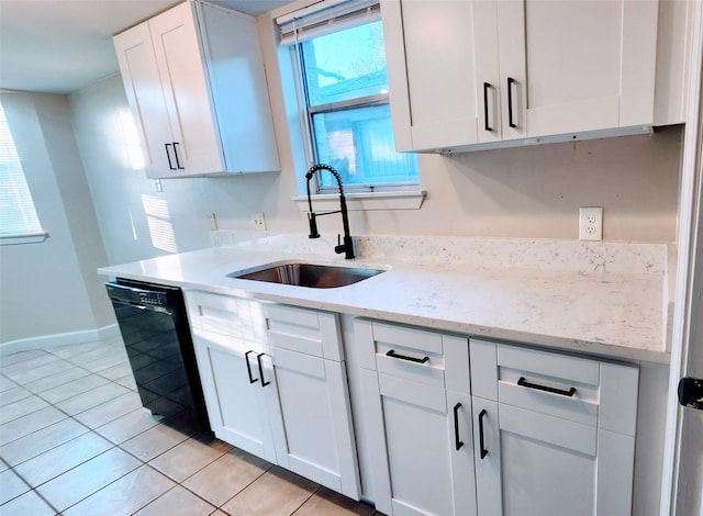 kitchen featuring white cabinetry, dishwasher, sink, light tile patterned floors, and light stone countertops