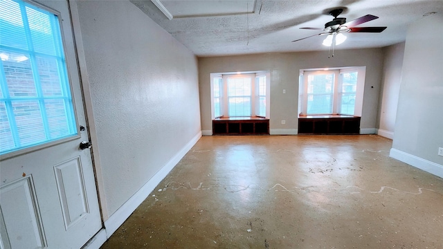 unfurnished room featuring a textured ceiling