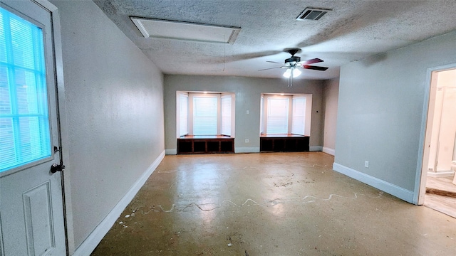 spare room with a textured ceiling