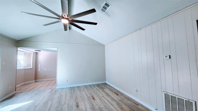 bonus room featuring ceiling fan, lofted ceiling, and light wood-type flooring