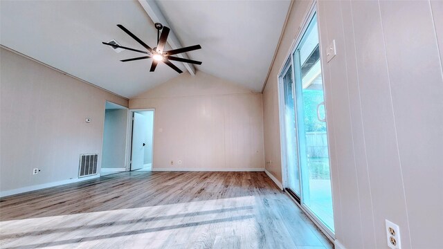 unfurnished room with lofted ceiling with beams, light hardwood / wood-style floors, and ceiling fan