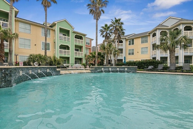 view of swimming pool featuring pool water feature