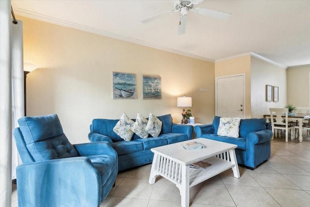 living room featuring ceiling fan, ornamental molding, and light tile patterned flooring