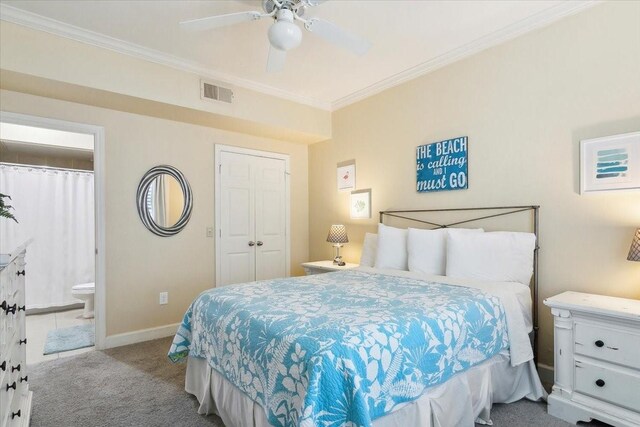 bedroom with ceiling fan, connected bathroom, ornamental molding, and light carpet