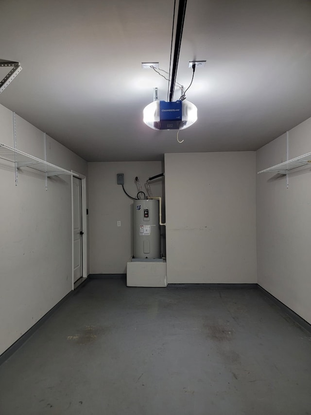 garage featuring electric water heater and a garage door opener