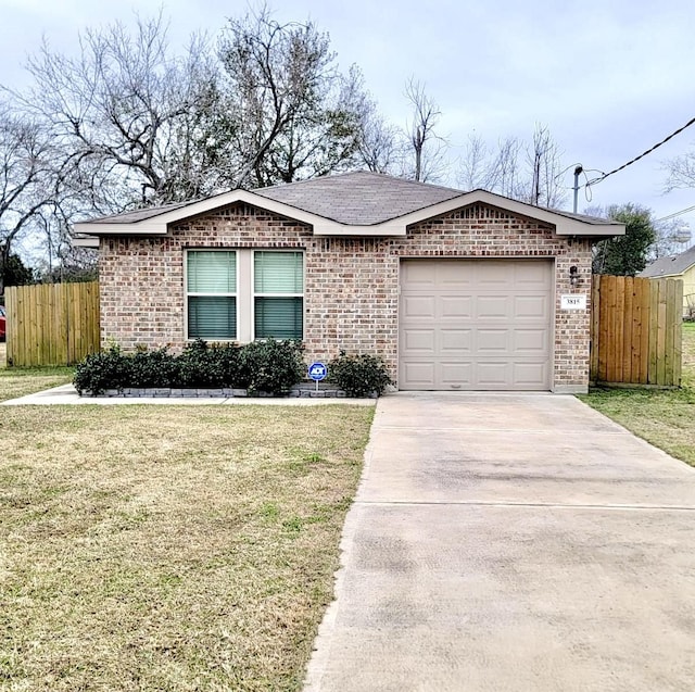 ranch-style house featuring a garage and a front lawn