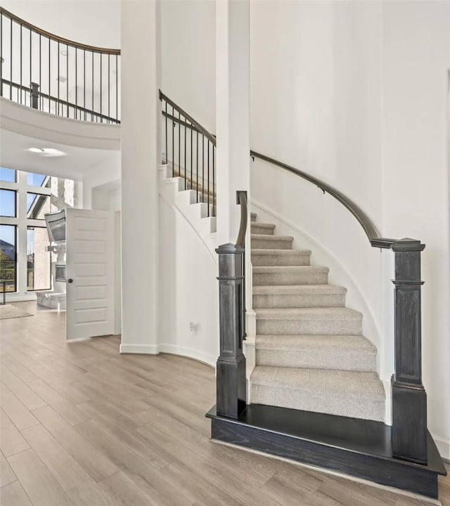 stairs with wood-type flooring