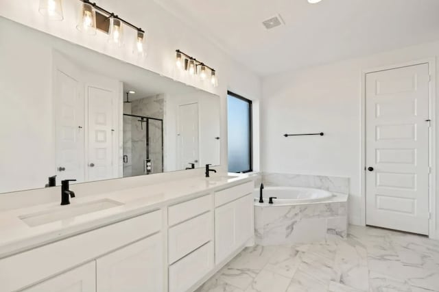 bathroom with independent shower and bath and vanity