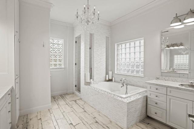 bathroom featuring vanity, crown molding, plus walk in shower, and a chandelier