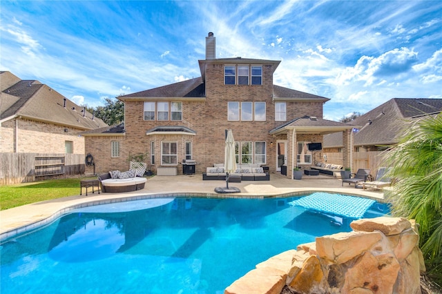 view of pool featuring area for grilling, an outdoor living space, and a patio