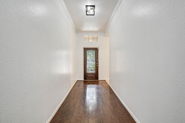 doorway to outside featuring dark wood-type flooring and crown molding