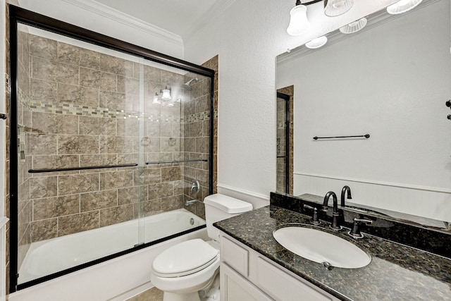 full bathroom with crown molding, combined bath / shower with glass door, toilet, and vanity