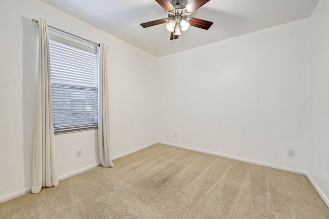 unfurnished room with ceiling fan and light colored carpet