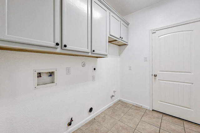 washroom featuring washer hookup, hookup for a gas dryer, hookup for an electric dryer, and light tile patterned floors