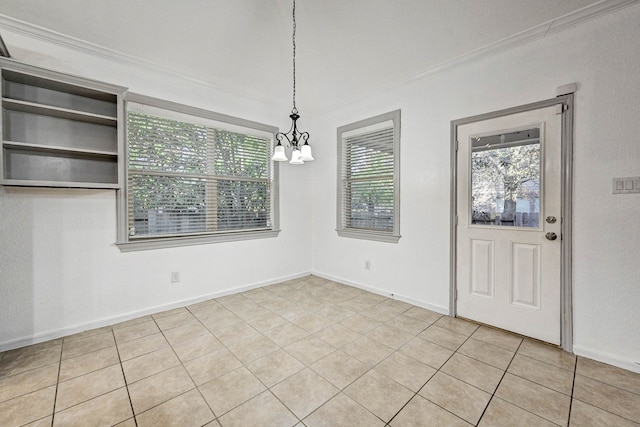 unfurnished dining area featuring light tile patterned floors, crown molding, and an inviting chandelier