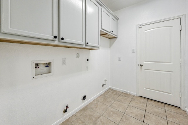 clothes washing area featuring electric dryer hookup, hookup for a washing machine, light tile patterned flooring, and hookup for a gas dryer