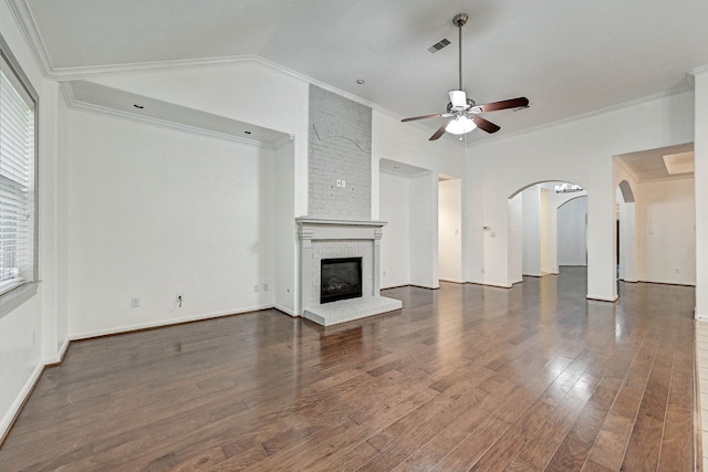 unfurnished living room with a fireplace, ceiling fan, and crown molding