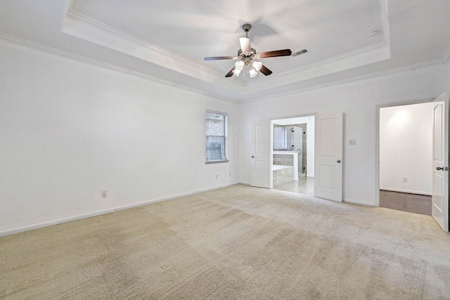 unfurnished bedroom with ceiling fan, crown molding, and a raised ceiling