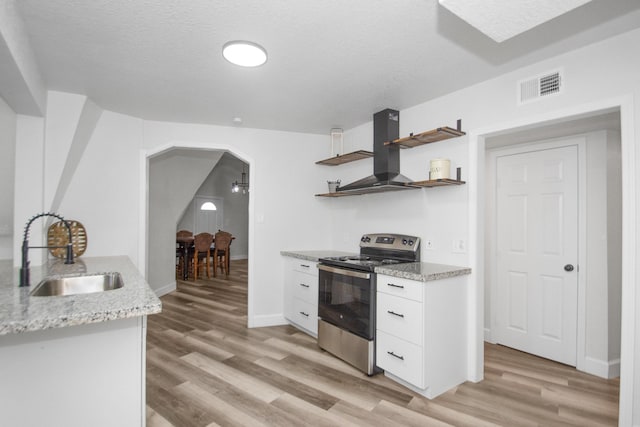 kitchen featuring a textured ceiling, white cabinetry, sink, stainless steel electric range, and range hood