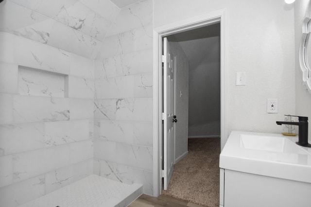 bathroom with vanity and walk in shower