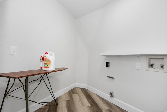 washroom with hardwood / wood-style floors and washer hookup