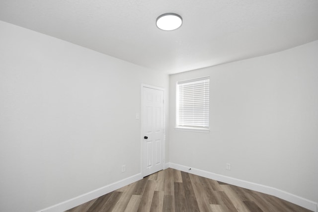 empty room featuring hardwood / wood-style floors