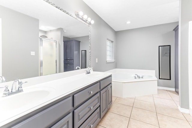 bathroom featuring independent shower and bath, tile patterned flooring, and vanity