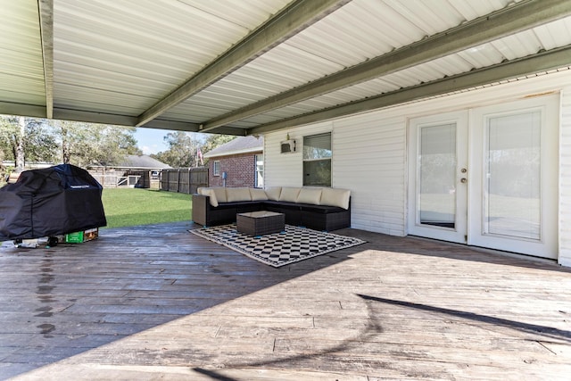 wooden deck with a yard, an outdoor hangout area, and grilling area