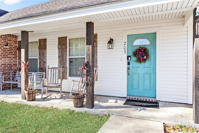 doorway to property featuring a porch