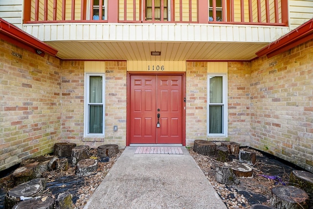 doorway to property featuring a balcony