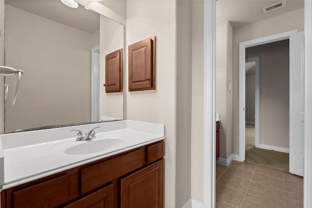 bathroom with vanity and tile patterned floors