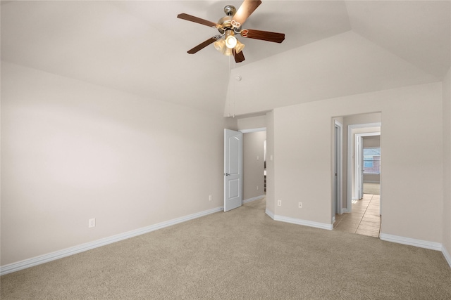 unfurnished bedroom featuring ceiling fan, lofted ceiling, and light carpet