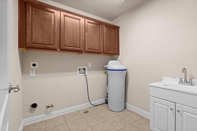 washroom with sink, hookup for a washing machine, electric dryer hookup, hookup for a gas dryer, and cabinets