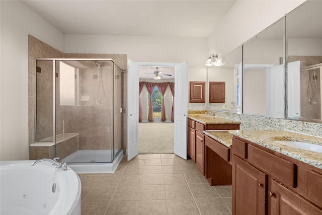 bathroom featuring independent shower and bath, tile patterned flooring, and vanity