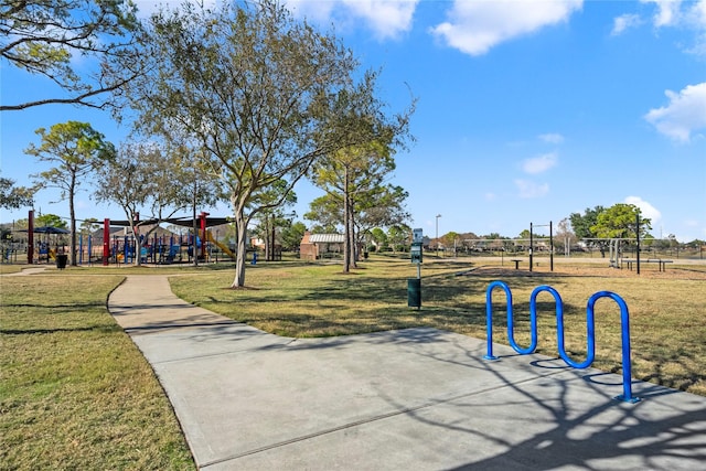 view of property's community featuring a playground and a yard