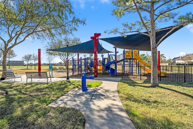 view of jungle gym featuring a lawn