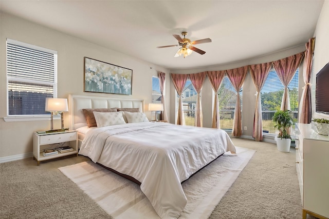 carpeted bedroom featuring ceiling fan and access to outside