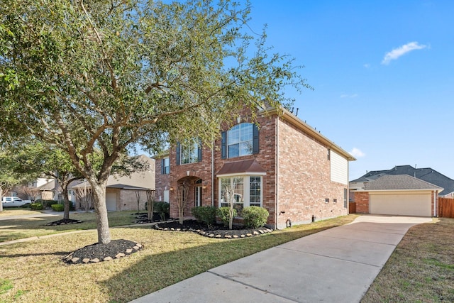 2511 Orchid Creek Dr, Pearland, TX 77584 - traditional-style house featuring brick siding, concrete driveway, and a front yard