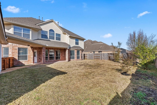 2511 Orchid Creek Dr, Pearland, TX 77584 - back of property featuring brick siding and a shingled roof