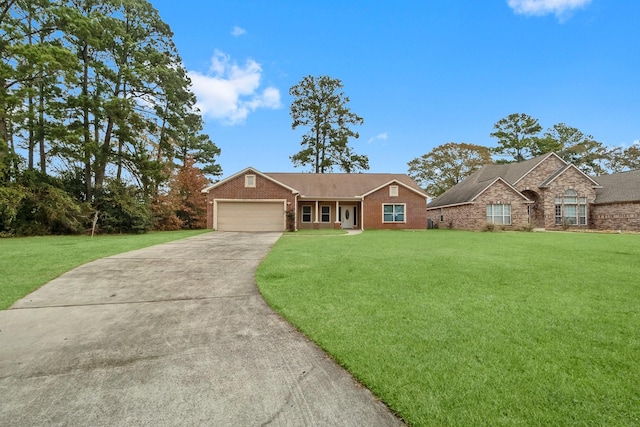 single story home featuring a garage and a front yard