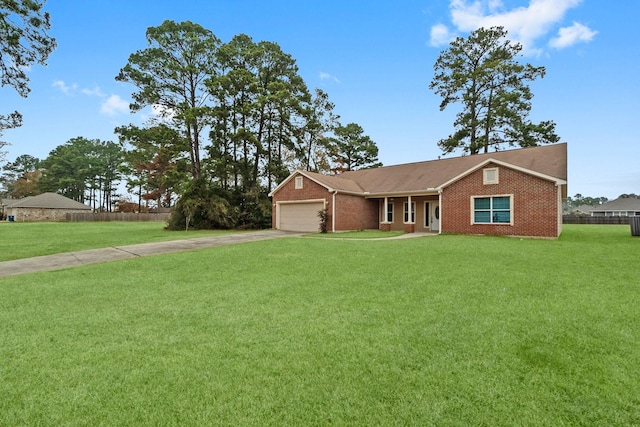 ranch-style home featuring a garage and a front lawn