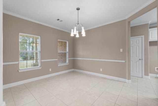 empty room featuring crown molding, light tile patterned floors, and an inviting chandelier