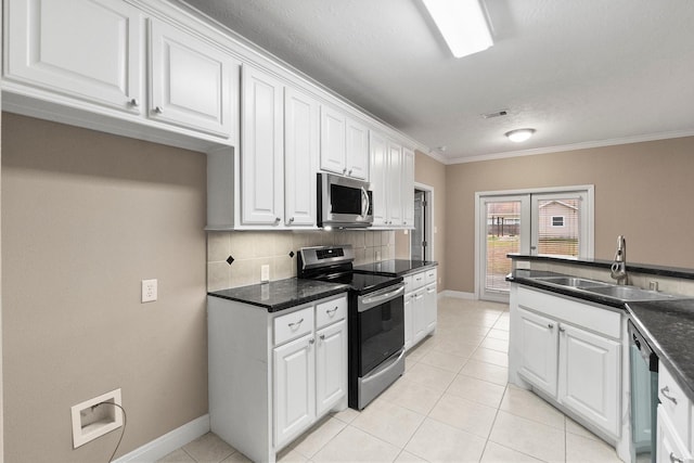 kitchen with sink, white cabinetry, crown molding, stainless steel appliances, and backsplash